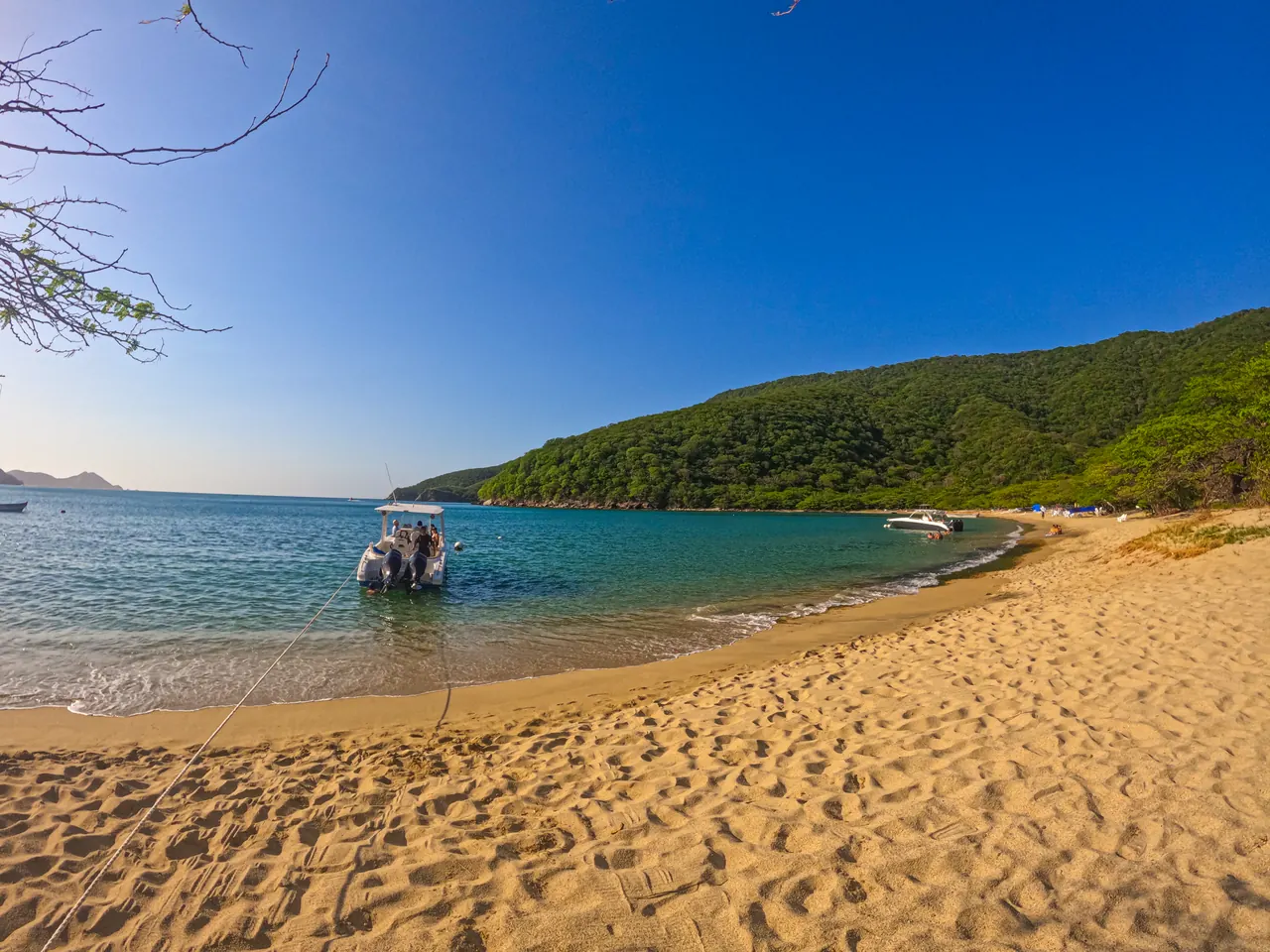 The wide beach at Bahía Concha, with a boat at anchor.