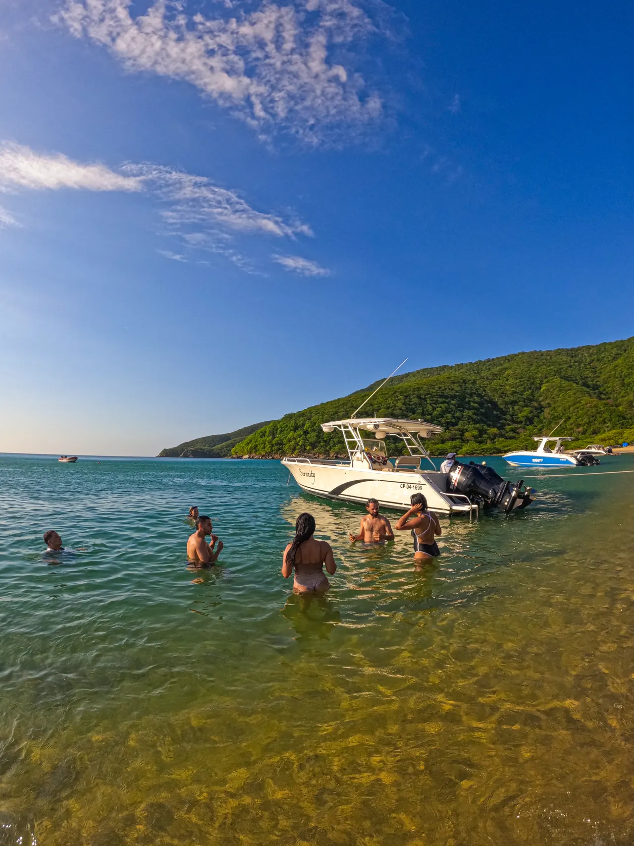 A group swimming next to the boat in Bahía Concha.