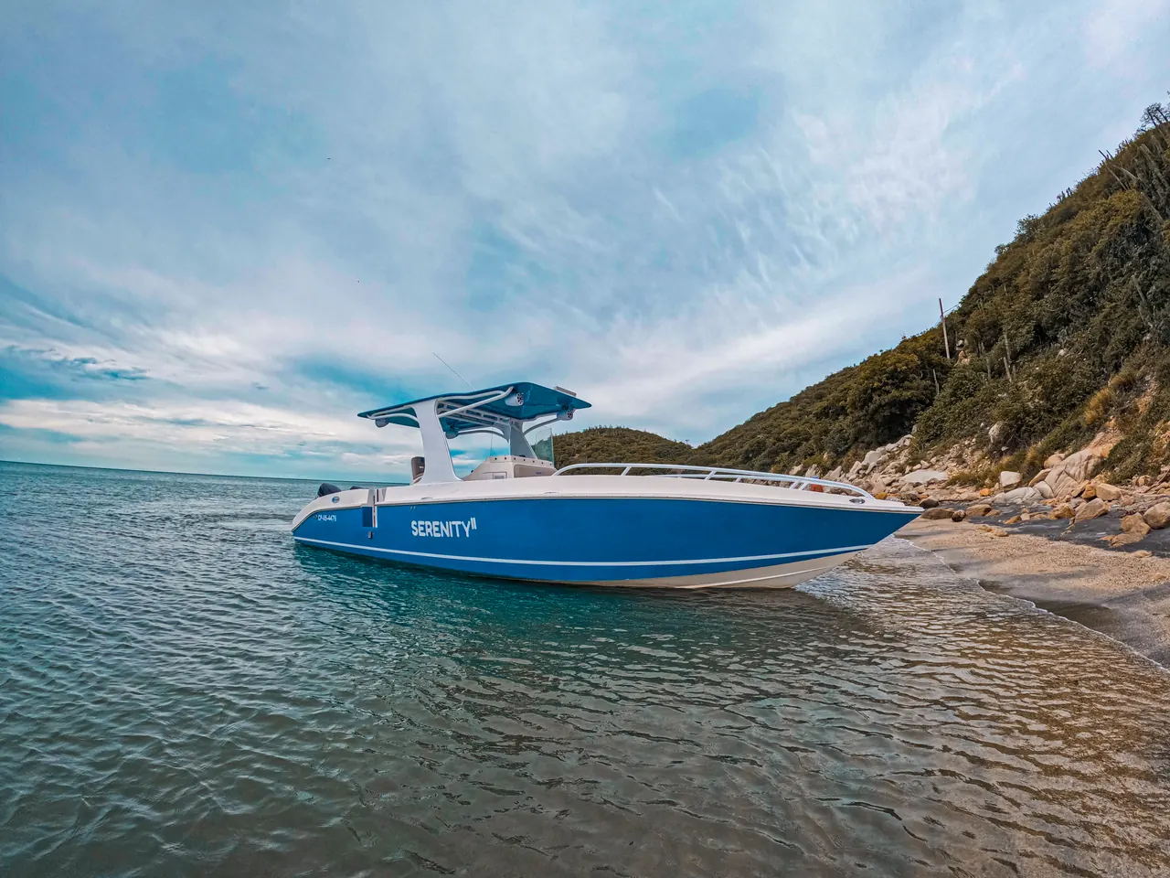 Serenity's boat anchored off the shore of Cabo Tortuga.