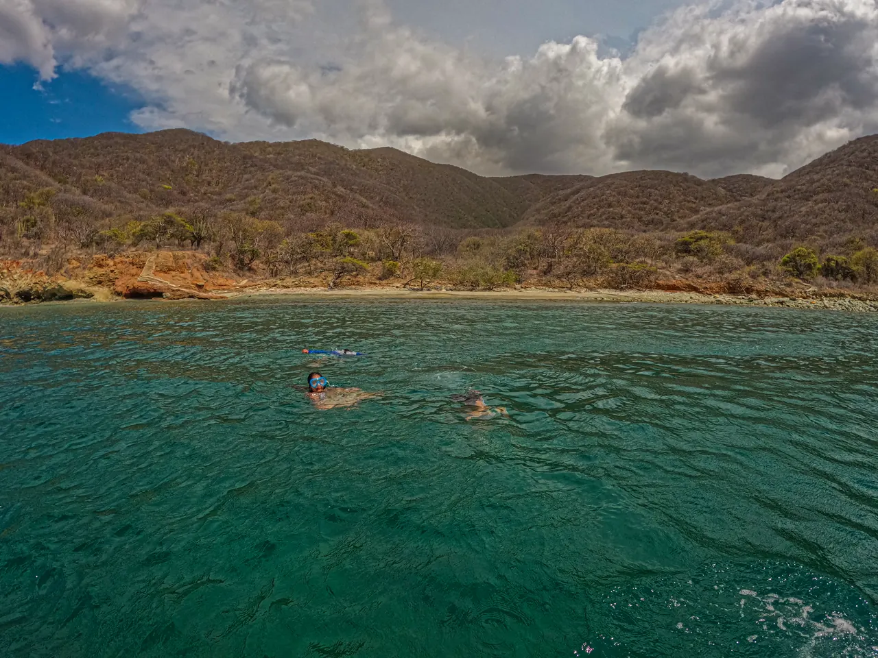Granate Bay, with its green waters and dry forest-covered mountains.
