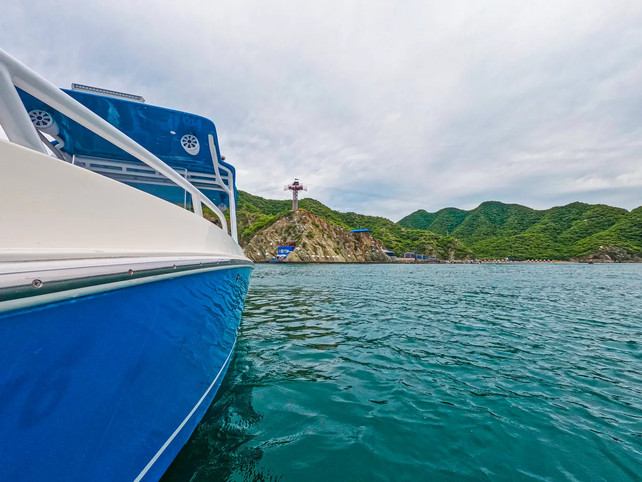 Serenity's boat sailing off Playa Blanca Beach.