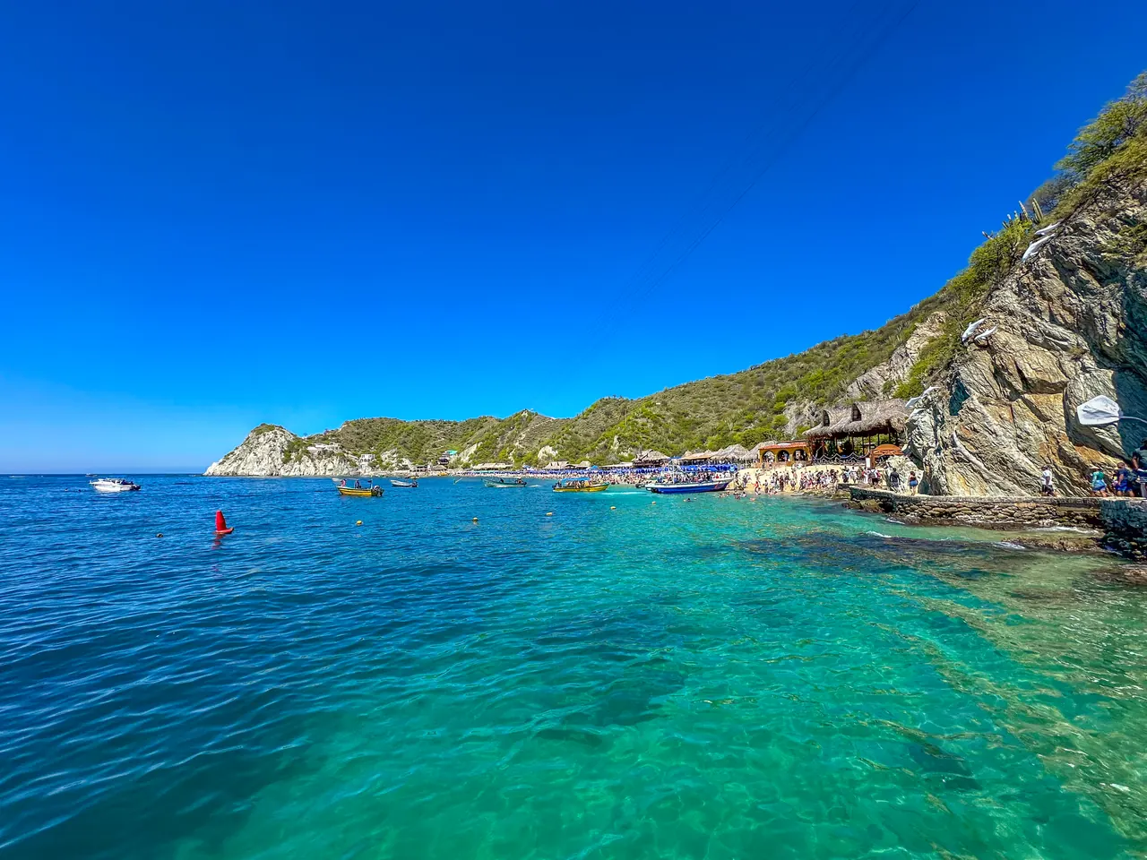 Turquoise waters next to the cliffs near Playa Blanca