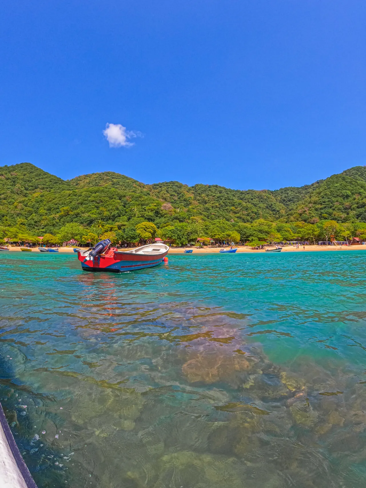 The seabed is visible through the clear water at Playa Cristal.