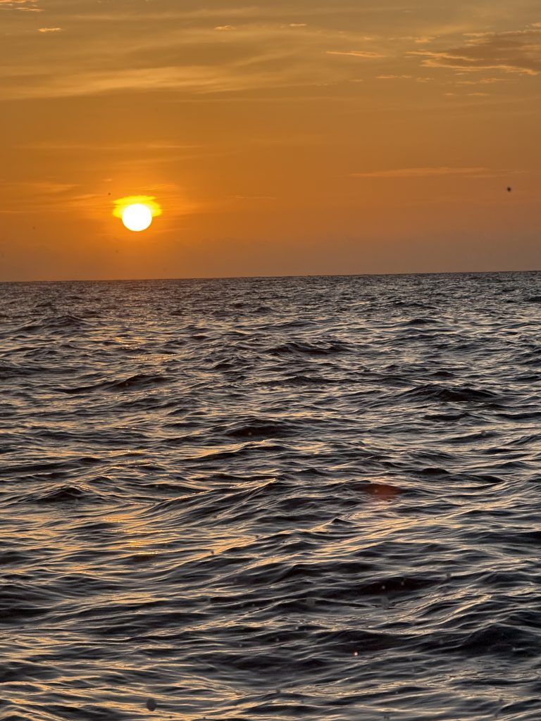 The setting sun reflected on the sea off the coast of Santa Marta.