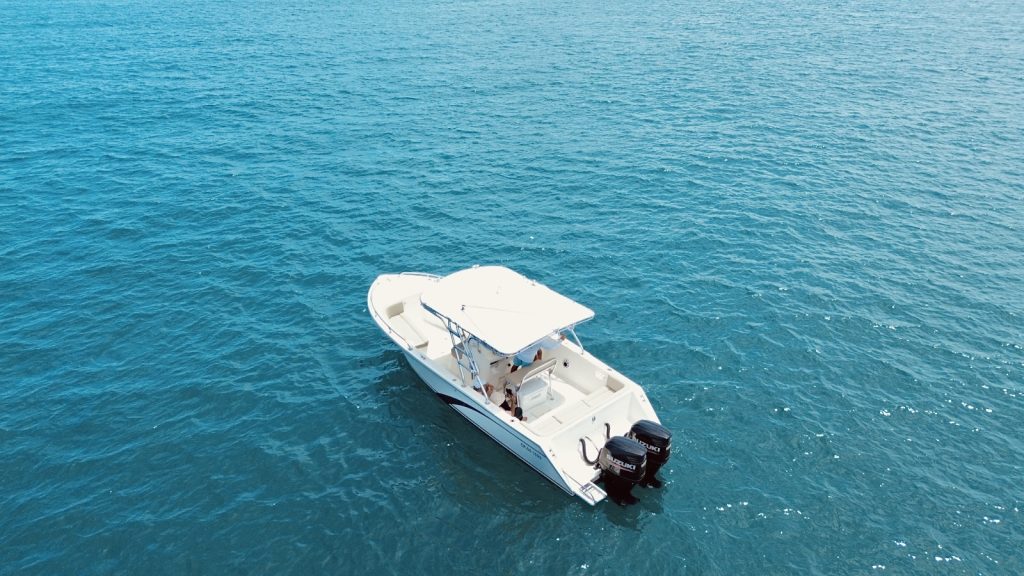 Aerial view of the boat in the blue waters off Taganga.
