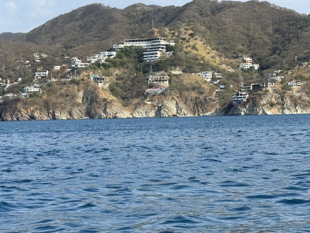 Cliffs with beachfront homes along the coast of Santa Marta.