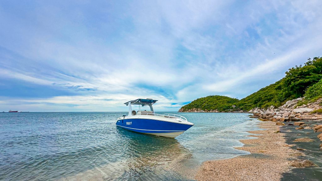 The Serenity II motorboat anchored off a beach in Santa Marta.